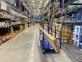 The roofing materials aisle at Lowes home improvement store that contains attic fans, roof coating and roofing materials