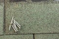 Roofing nails on shingle