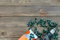 Roofing screws and a drill on a wooden table. The view from the top. Place for advertising and labels.Roofer, roofing work Royalty Free Stock Photo