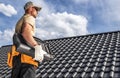 Roofing Worker with a Ceramic Roof Tiles in His Hands Royalty Free Stock Photo