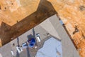 Roofing worker installing new shingles on the roof of a house during construction Royalty Free Stock Photo