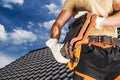 Roofing Worker Moving a Black Roof Ceramic Tiles Royalty Free Stock Photo