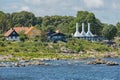 The roofs and chimneys of very small smoke houses so typical and famous for small village of Svaneke on Bornholm island in Denmark Royalty Free Stock Photo