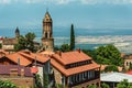 Roofs of houses against the cloudy sky. Old city. Georgia. Royalty Free Stock Photo