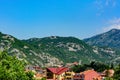 Roofs of houses in the background of mountains. View of the city of Cetinje, Montenegro Royalty Free Stock Photo