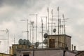 Roofs of houses full of TV antennas, satellite dishes