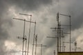 Roofs of houses full of TV antennas, satellite dishes