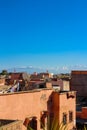 The roofs of Moroccan houses where Laundry is dried, a lot of satellite dishes against the background of the Atlas mountains.