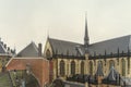 Roofs of old Dutch traditional medieval houses, Westerkerk church in Amsterdam, bell tower Royalty Free Stock Photo