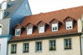 Roofs of old houses with roof windows and orange roof tiles in G Royalty Free Stock Photo