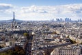 Aerial drone view of Paris in summer with Eiffel Tower, historical city center and La Defense financial district, France