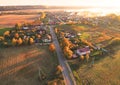 Suburb houses in rural, aerial view. Car driving on road in countryside. Royalty Free Stock Photo