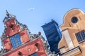 Roofs (tops) of famous Stockholms houses and airplane... Royalty Free Stock Photo