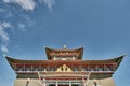 Roofs and visor of entrance door of Buddhist temple. Ivolginsky datsan, Buryatia, Russia.