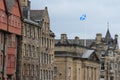 Roofs and a waving flag in the city Edinburgh in Scotland.