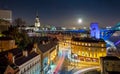 Rooftop Aerial View of British Cityscape at Night with Full Moon, Newcastle upon Tyne, UK