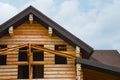 Rooftop construction on a new wooden building structure.