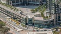 Rooftop garden with palms near entrance to office towers in financial district of Dubai city timelapse