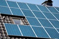 Rooftop of house supplied with sun panel system installation in use.Modern ecologically friendly solution for production of Royalty Free Stock Photo