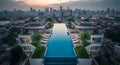 Luxury rooftop infinity pool at sunset with city skyline view Royalty Free Stock Photo