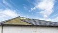 Rooftop with metal tile on blue sky background Royalty Free Stock Photo