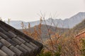 Rooftop and Misty Mountain Views at Yuntaishan in China Royalty Free Stock Photo