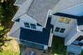 Rooftop in a newly home constructed showing asphalt shingles multiple roof lines Royalty Free Stock Photo