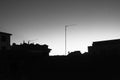 Rooftop silhouettes in black and white during a colourful dawn in Soria Spain