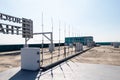 Rooftop small radio communication tower antenna and television. Sky with bright sunlight is background. Royalty Free Stock Photo