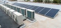 Rooftop solar panels and air conditioning on top of an apartments in australia