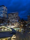 Rooftop view of rush hour traffic and night life starting up in downtown in the late Royalty Free Stock Photo