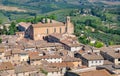 Rooftop view on Tuscany town and fields. San Gimignano medieval city houses and natural landscape, Italy Royalty Free Stock Photo