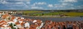 Rooftops of Alcacer do Sal waterfront with a view of the Sado River and agricultural fields Royalty Free Stock Photo