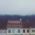 Rooftops in Brasov, Romania, on a Foggy Winter`s Day