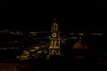 Rooftops and church towers illuminated at night in Thira, Santorini Royalty Free Stock Photo