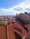 Rooftops of Lisbon houses on a sunny day overlooking the river and the ocean Royalty Free Stock Photo