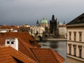 Rooftops of Mala Strana neighborhood with view of Charles Bridge in Prague Royalty Free Stock Photo