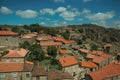 Rooftops of stone houses and large wall Royalty Free Stock Photo