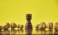 Rook winning the game, last chess piece standing on a yellow background. Royalty Free Stock Photo