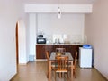 A room in an apartment with a kitchen and dining table Royalty Free Stock Photo