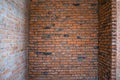 A room with bare brick walls. Brick wall at construction site