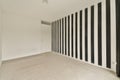 a room with black and white stripes on the wall Royalty Free Stock Photo