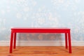 Room with blue vintage wall paper and red bench Royalty Free Stock Photo