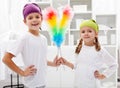 Room cleaning taskforce - kids with dust brushes Royalty Free Stock Photo