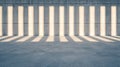 A room with a concrete wall and floor, featuring a series of rectangular openings and a light source casting a pattern of shadows. Royalty Free Stock Photo