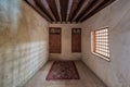 Room at El Sehemy house, a historic old house with embedded wooden cupboard, wooden window and colorful carpet, Cairo, Egypt Royalty Free Stock Photo