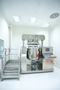 A room with an equipment for pill production