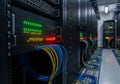 A room filled with server racks housing electronic equipment. Each Royalty Free Stock Photo
