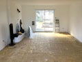 A room in full renovation with the floor to redo