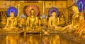 A room of golden Buddhas at the Shwedagon Pagoda, Yangon